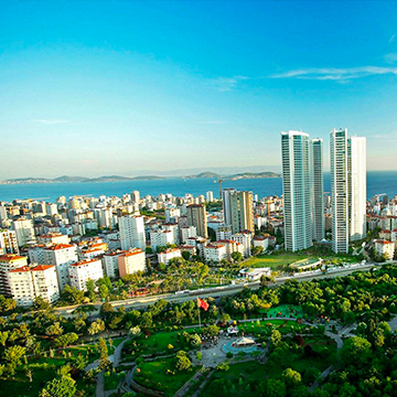 city view with park at the center surrounded with greenery